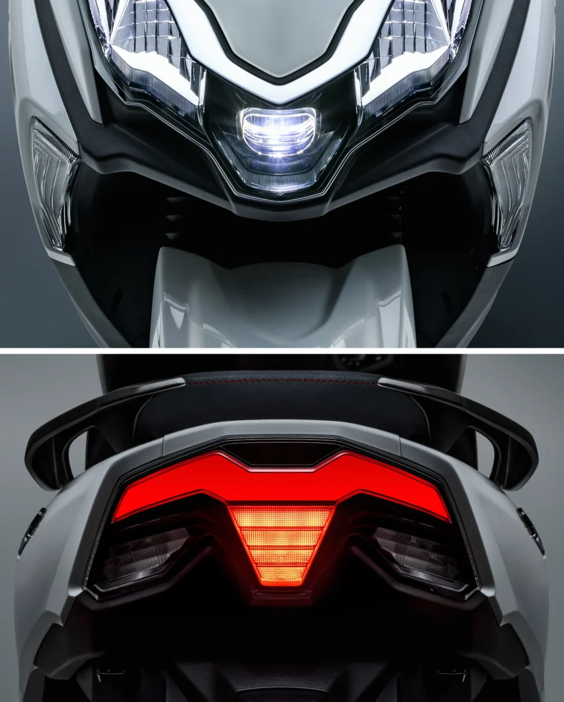 Detalhe do farol dianteiro Full LED e da lanterna traseira em LED acesa da scooter Haojue Burgman ADX 125.